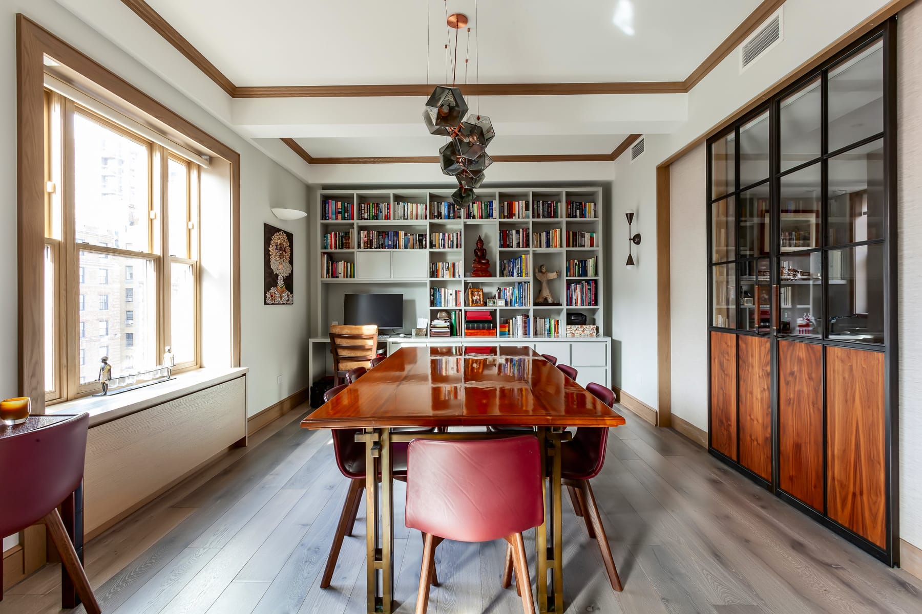 Living room with custom bookshelf and wall sliding doors