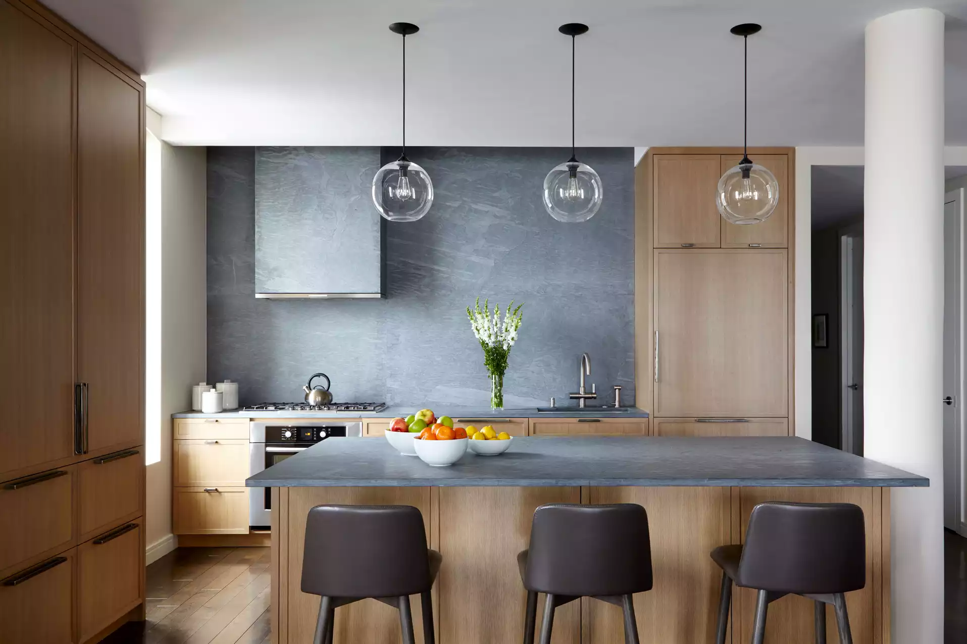 Kitchen with island and stone backsplash